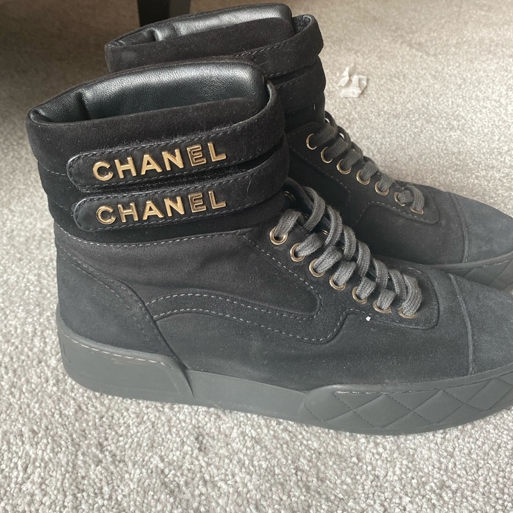 Chanel black high top sneakers with gold chanel at top. 37